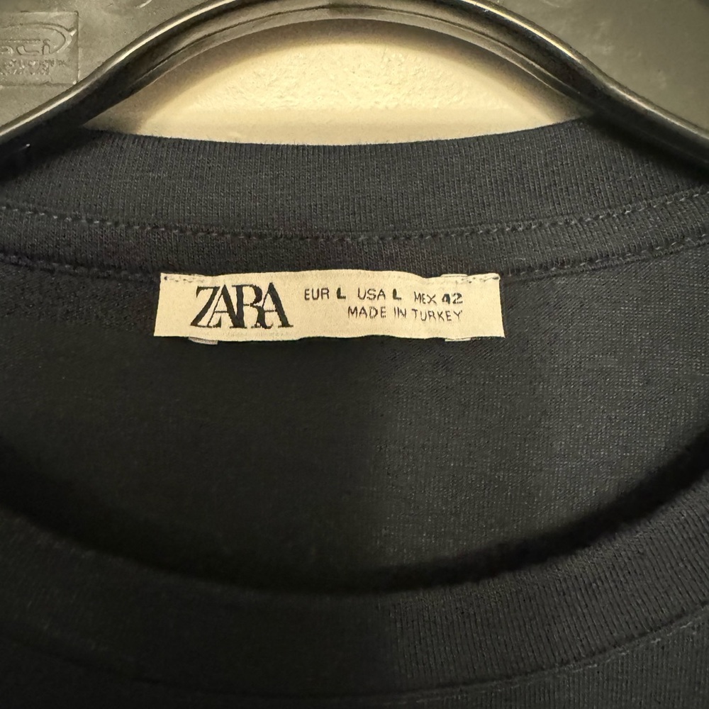 Multiple men’s Zara shirts.